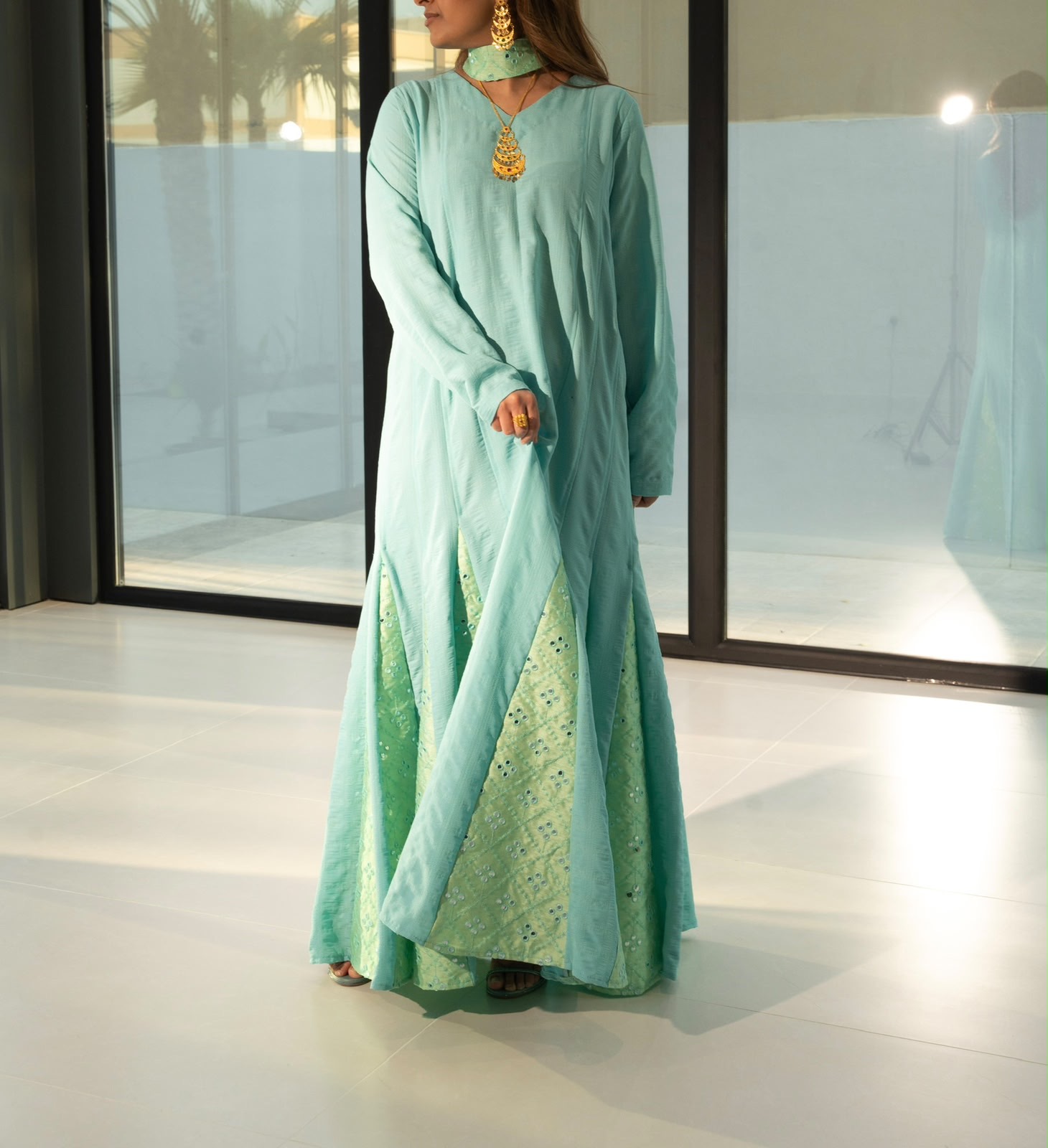 Front view of the Appliqué sage eyelet kaftan, modest luxury daywear from Bahrain