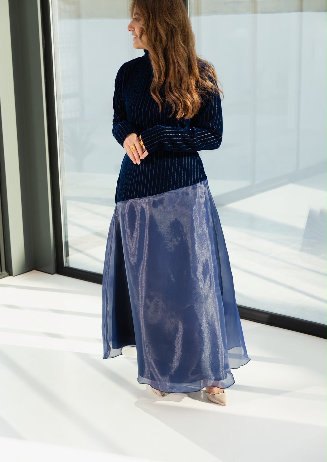 Side profile of the Moonlight abaya showing the flowing organza skirt