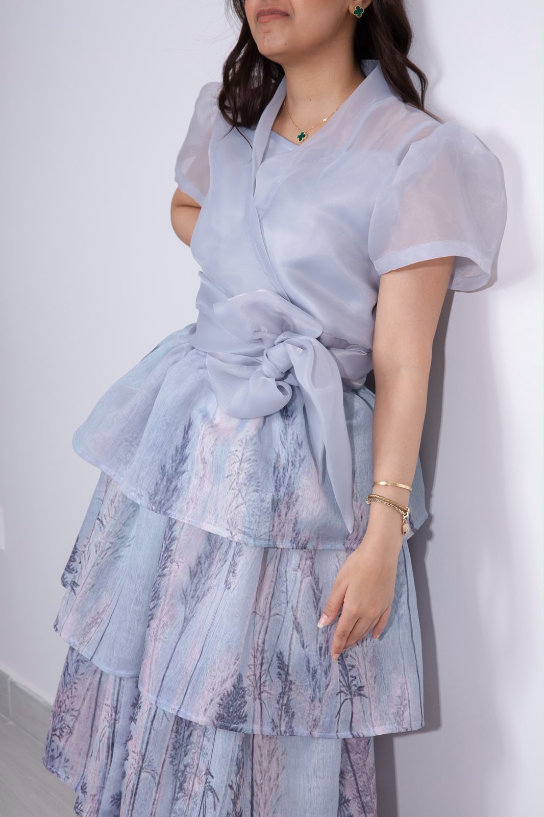 Detail of the lilac organza sash bow and printed tier skirt