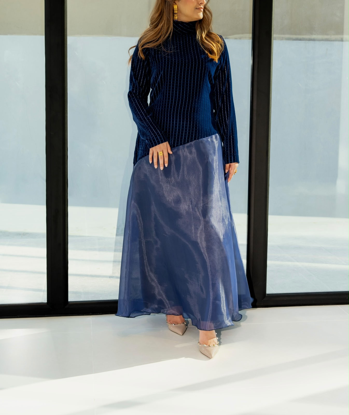 Appliqué Moonlight abaya in navy velvet with embroidered organza skirt — front view