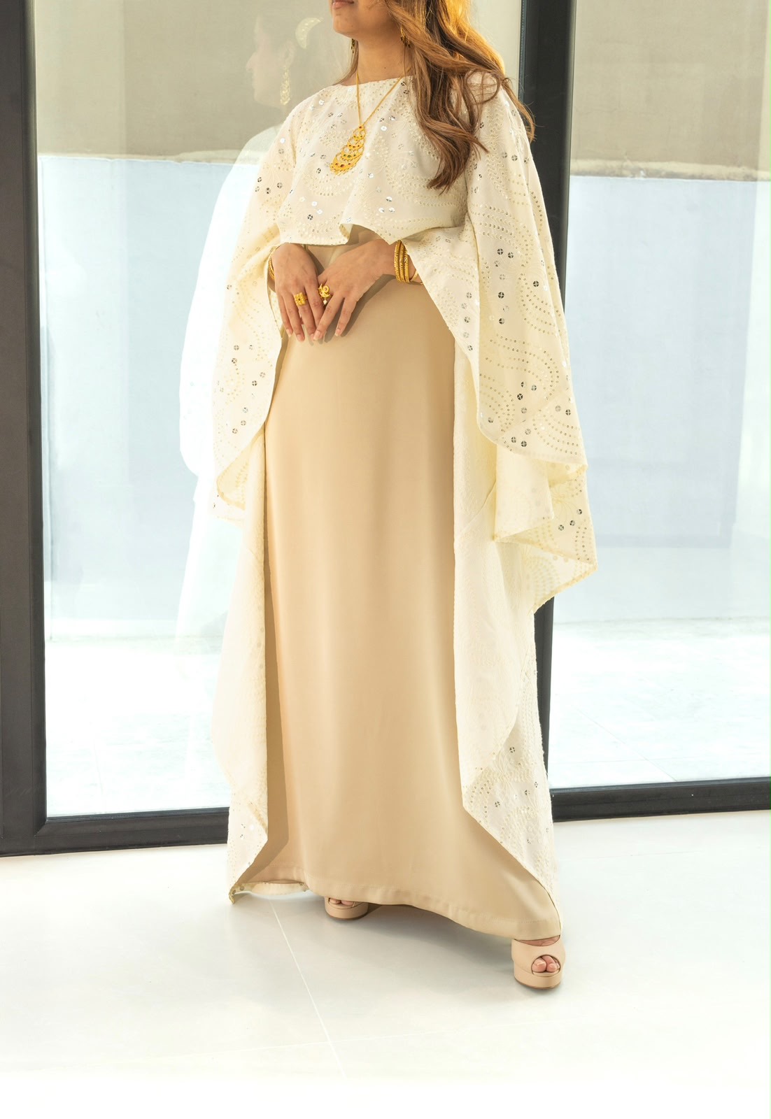 Champagne cape by Appliqué: cream silk slip under a sequin cape
