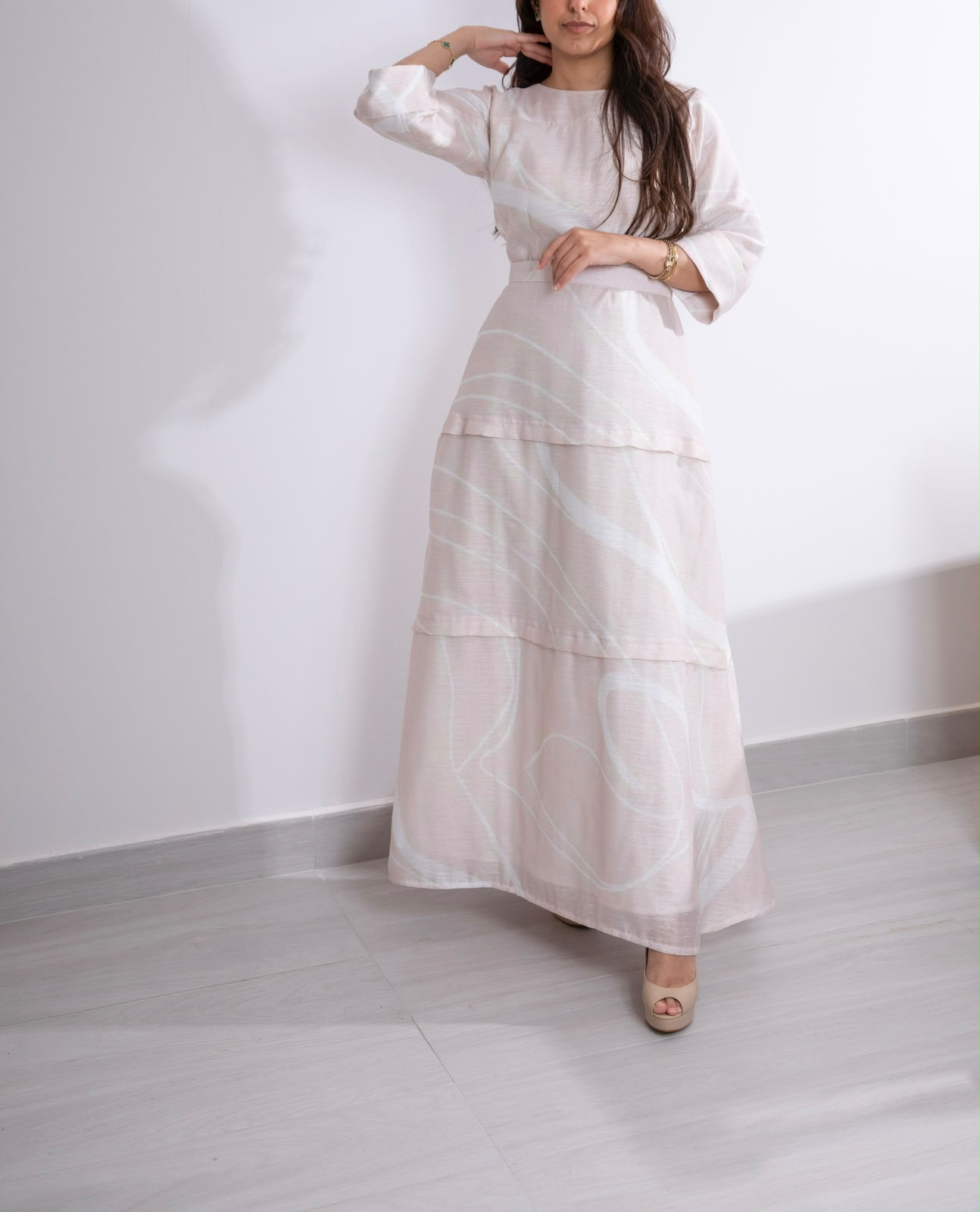 Front view of the Appliqué Blush Brushstroke dress with tie waist